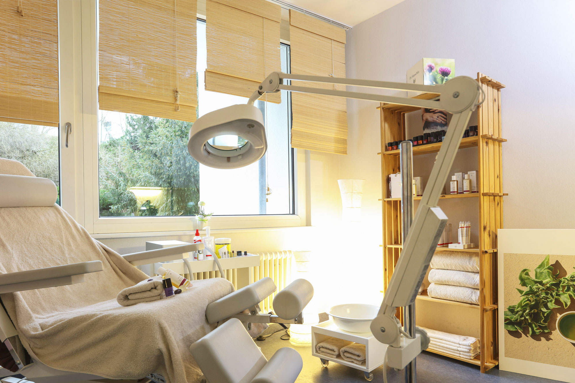 Treatment room in the wellness area of the hotel Schwarzwald Panorama with treatment couch and care products