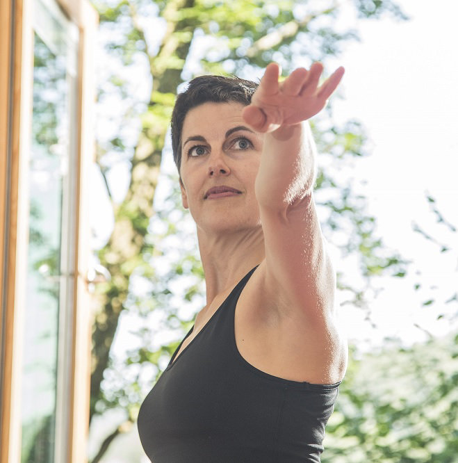 A portrait of Kerstin Weinbrecht, certified yoga teacher and selfness coach, helping you on your activity break at the hotel SCHWARZWALD PANORAMA